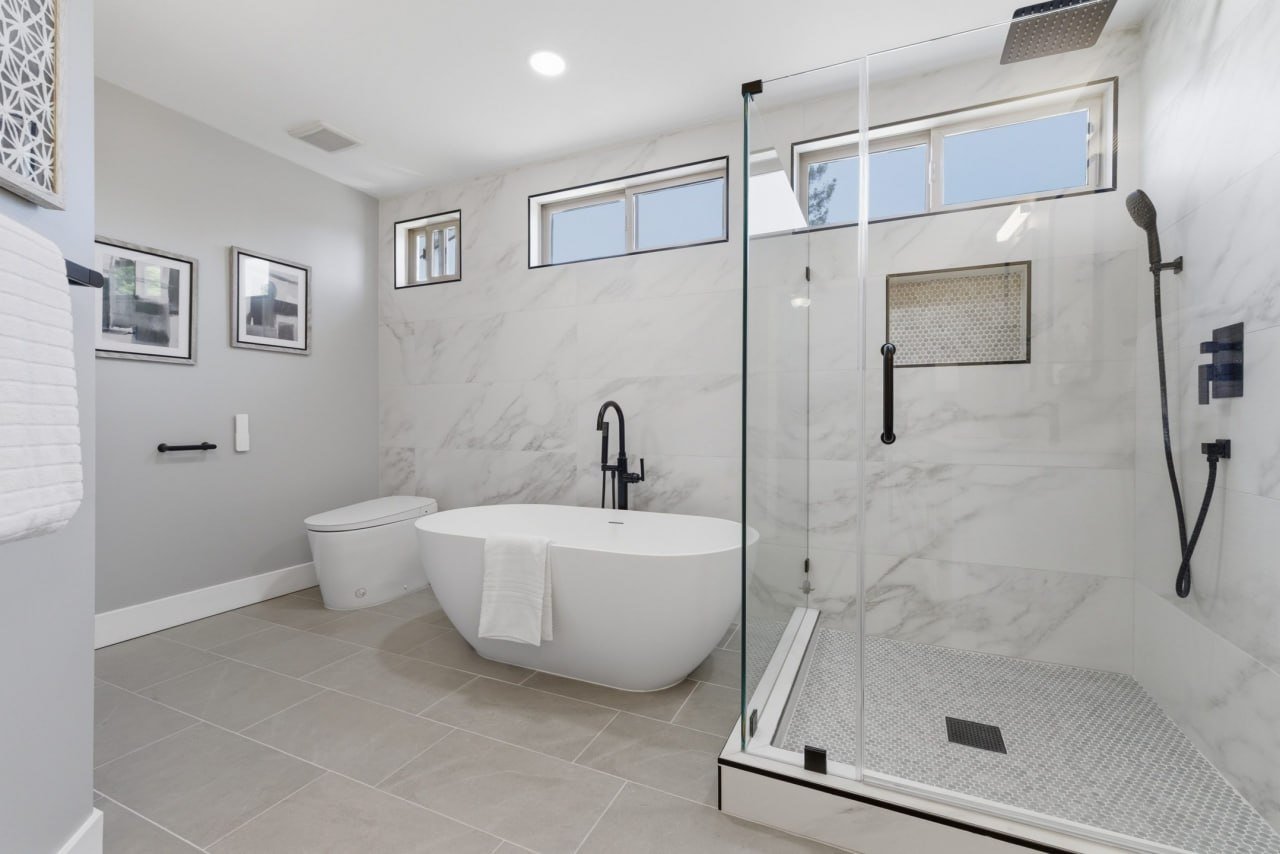 Primary bath remodel with freestanding tub and glass shower
