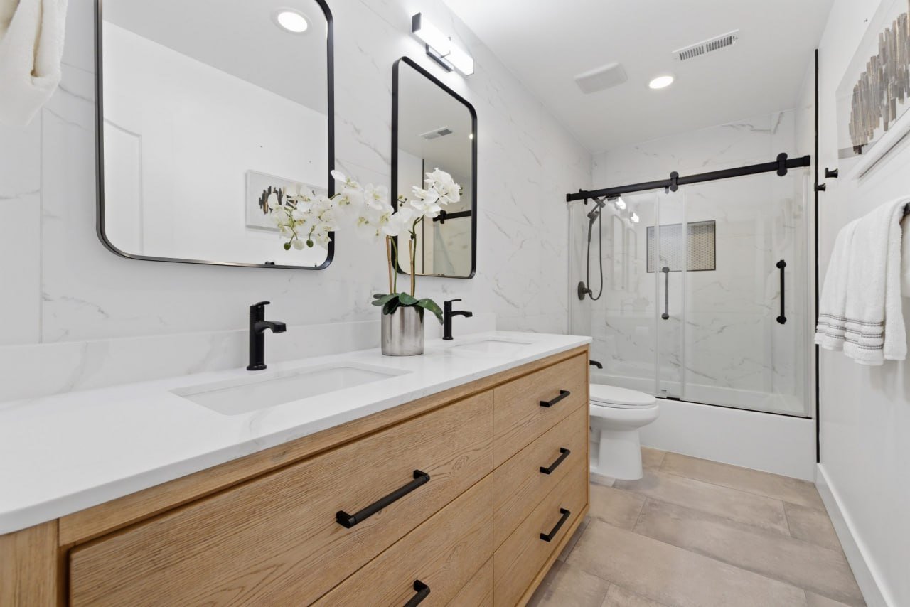 Primary bath remodel with double vanity and glass shower
