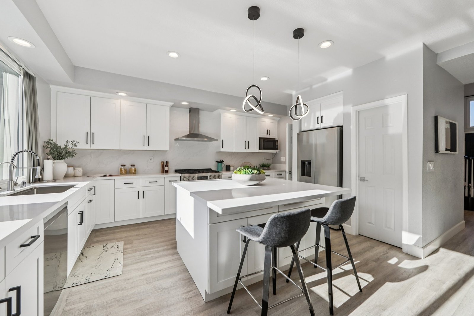 Completed kitchen remodel in Dublin with white cabinets and an island